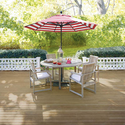 Outdoor table and chairs with umbrella.