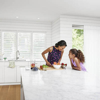 Mother and daughter in a white kitchen